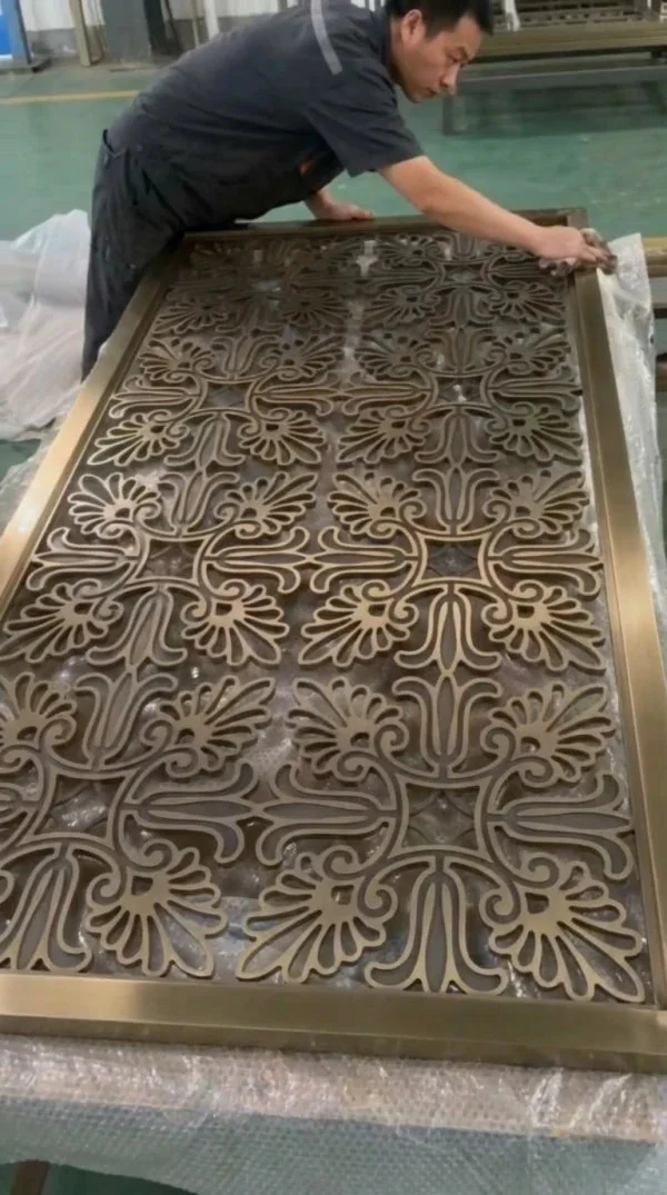 Quality control inspector examining intricate laser-cut patterns for burrs or scratches.