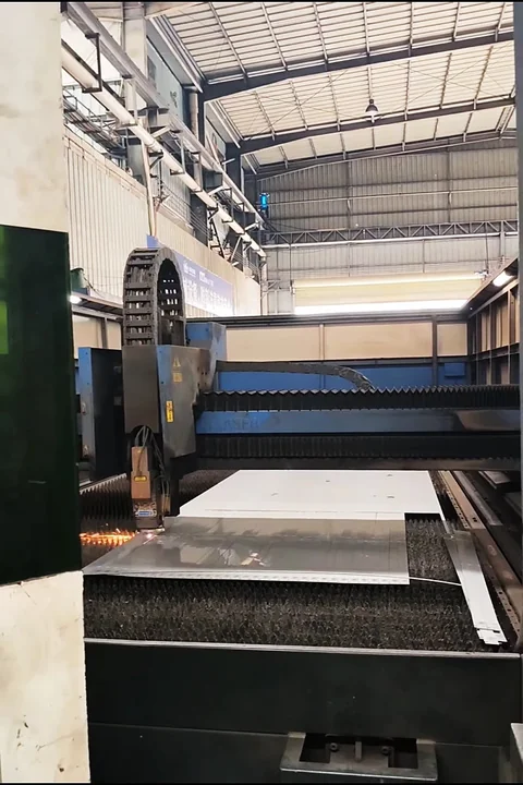 Laser cutting head in operation — fiber laser at work.
